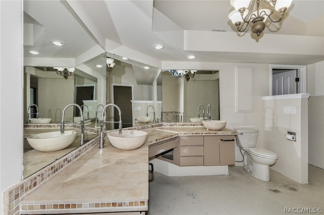 bathroom featuring a chandelier, toilet, vanity, and concrete floors