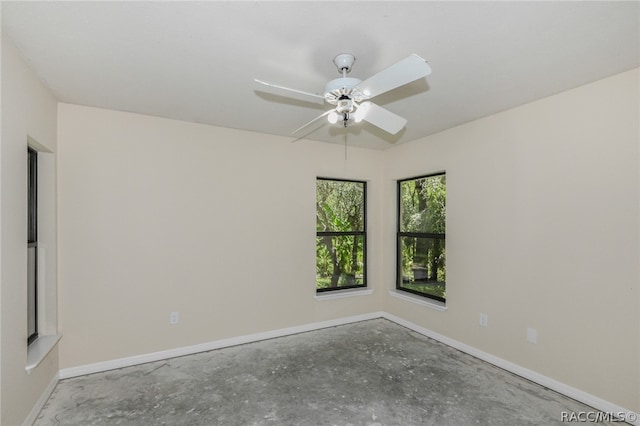 unfurnished room with concrete flooring and ceiling fan