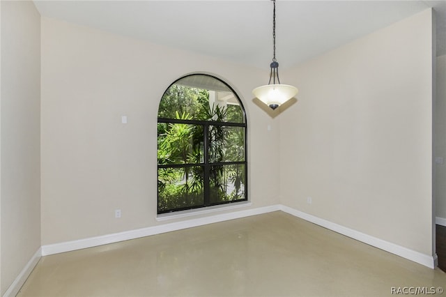 spare room featuring concrete flooring