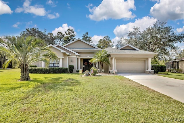 single story home featuring a garage and a front lawn