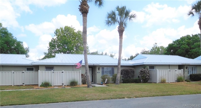 ranch-style home with a front yard