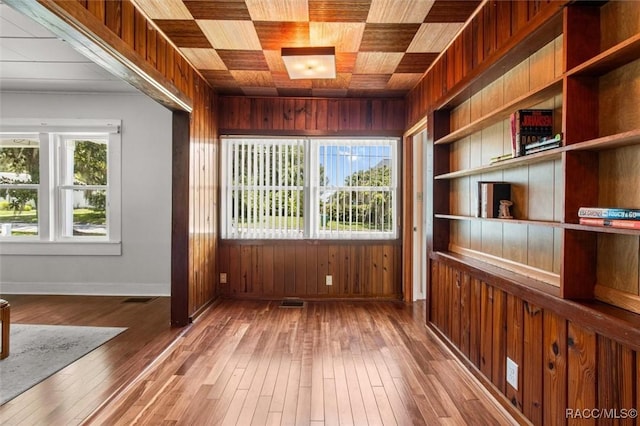 218 N Osceola Ave, Inverness, FL 34450 - unfurnished room featuring wood walls, wood-type flooring, and wood ceiling