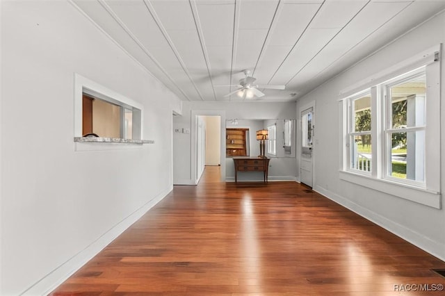 218 N Osceola Ave, Inverness, FL 34450 - unfurnished living room with wood finished floors and a ceiling fan