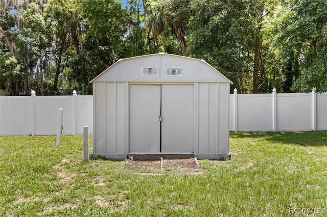 218 N Osceola Ave, Inverness, FL 34450 - view of shed featuring a fenced backyard and view of wooded area