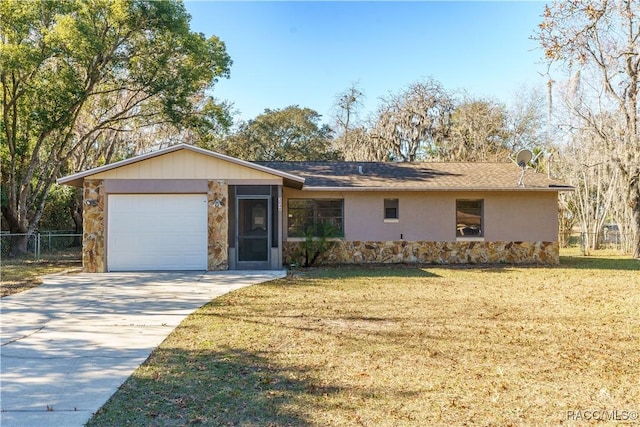 ranch-style home with a front yard and a garage