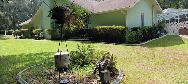 view of yard with glass enclosure