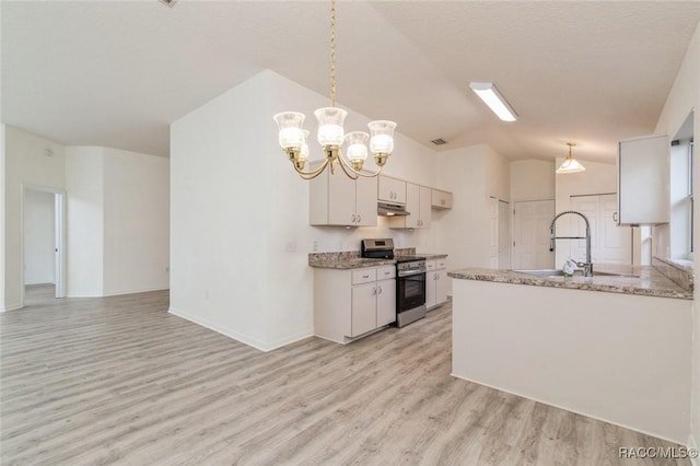 kitchen with lofted ceiling, white cabinetry, hanging light fixtures, stainless steel range oven, and light wood-type flooring