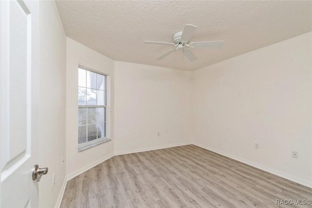 unfurnished room featuring ceiling fan, a textured ceiling, and light hardwood / wood-style flooring