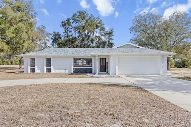 ranch-style house featuring a garage