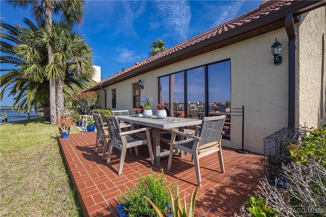 view of patio featuring outdoor dining area
