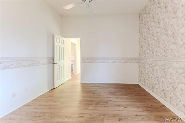 spare room with ceiling fan and light hardwood / wood-style flooring