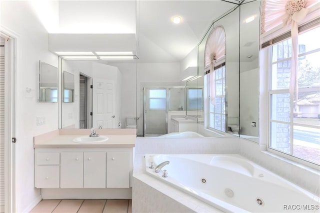 full bathroom with tile patterned floors, a healthy amount of sunlight, toilet, and independent shower and bath