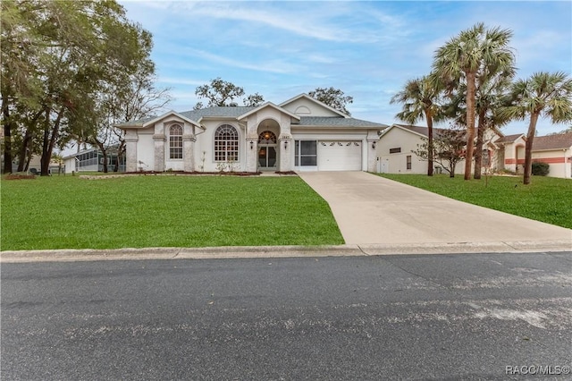 ranch-style house featuring a garage and a front lawn