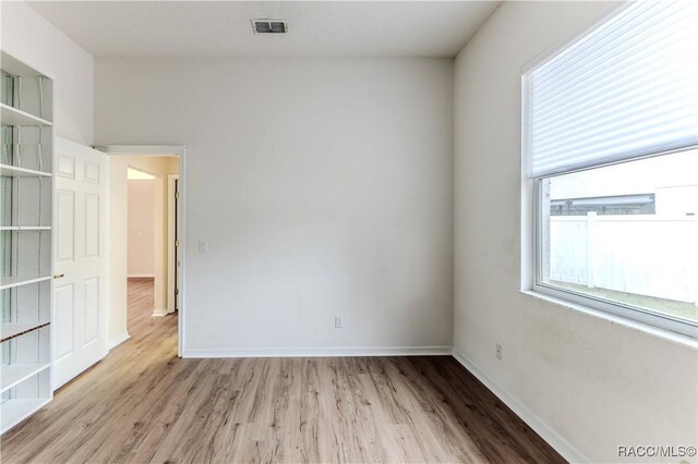 spare room featuring light hardwood / wood-style floors