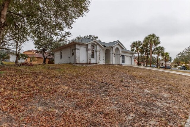 single story home with a garage