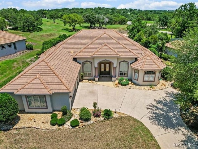 2622 N Carnoustie Loop, Lecanto, FL 34461 - view of front of property with a tiled roof, stucco siding, and french doors