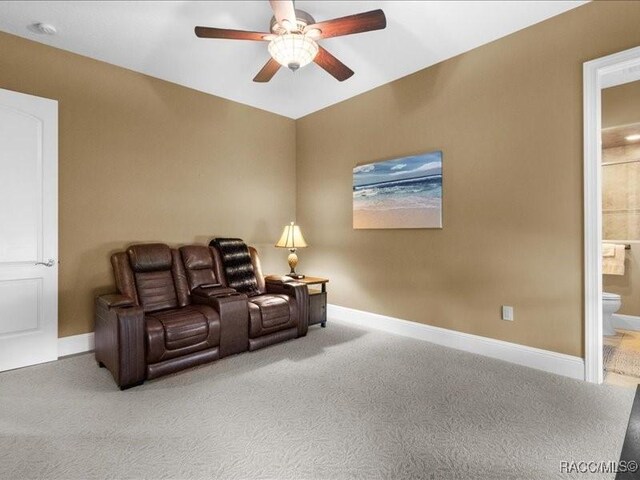 2622 N Carnoustie Loop, Lecanto, FL 34461 - home theater room with a ceiling fan, carpet flooring, and baseboards