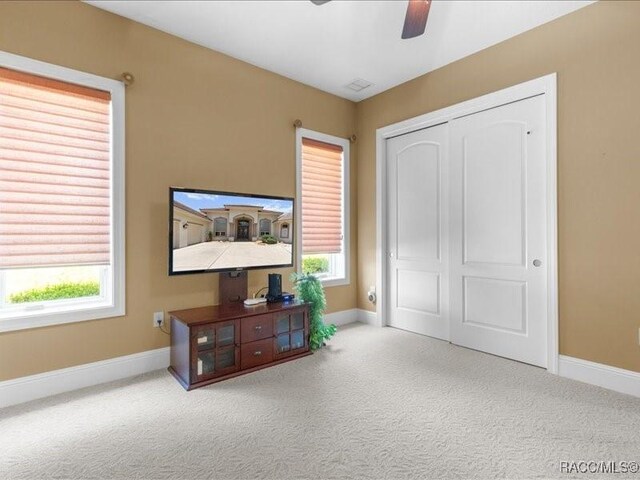 2622 N Carnoustie Loop, Lecanto, FL 34461 - bedroom featuring carpet, baseboards, a closet, and ceiling fan