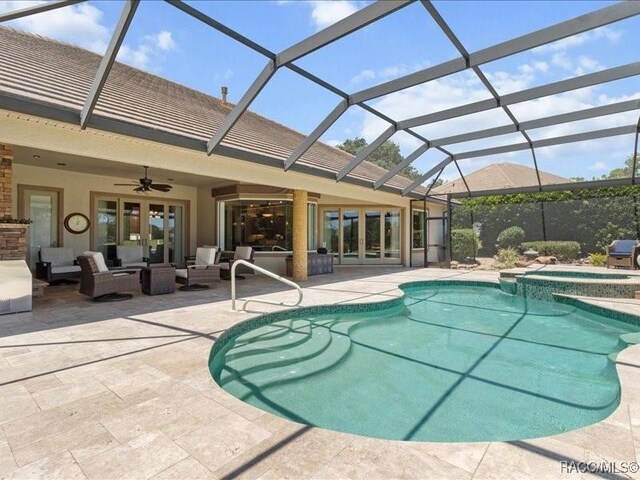 2622 N Carnoustie Loop, Lecanto, FL 34461 - view of pool with french doors, ceiling fan, an outdoor hangout area, and a patio