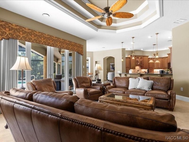 2622 N Carnoustie Loop, Lecanto, FL 34461 - living room featuring ceiling fan, arched walkways, a raised ceiling, and light tile patterned floors