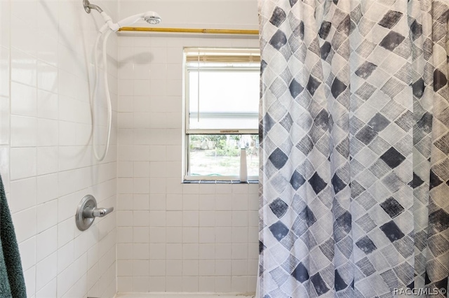 bathroom featuring a shower with curtain