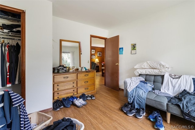 bedroom featuring light hardwood / wood-style floors and a closet