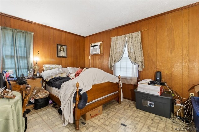 bedroom with wooden walls and crown molding