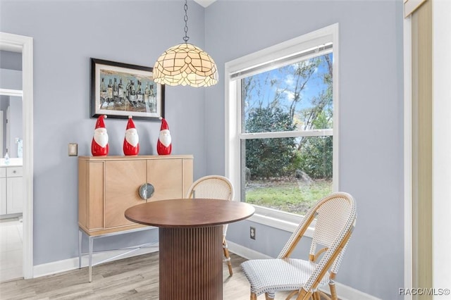 dining area featuring light wood-type flooring