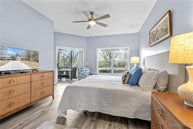 bedroom with access to exterior, light hardwood / wood-style flooring, and ceiling fan