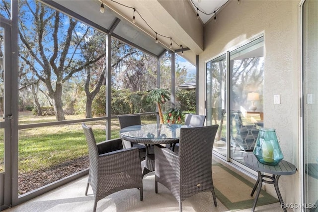 sunroom / solarium with lofted ceiling