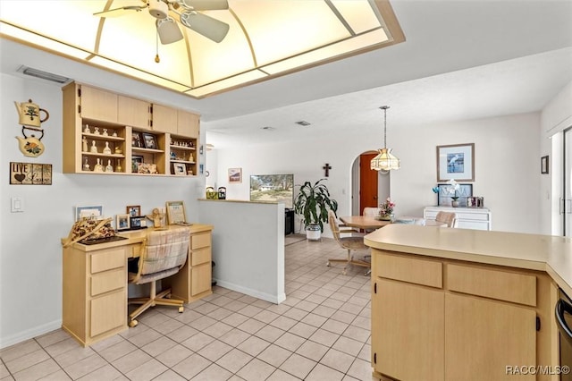 kitchen with ceiling fan, light tile patterned floors, light brown cabinetry, decorative light fixtures, and kitchen peninsula