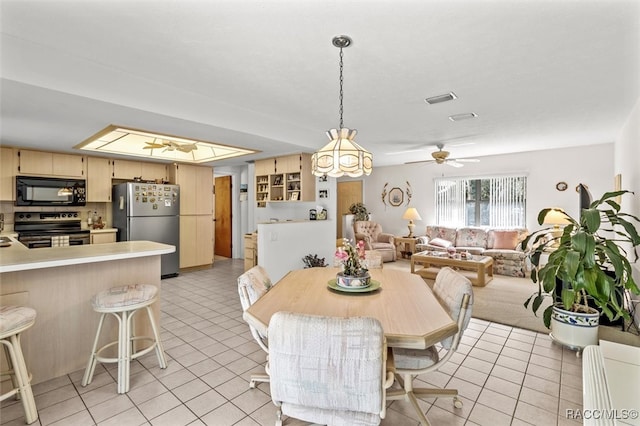 dining room featuring ceiling fan and light tile patterned floors