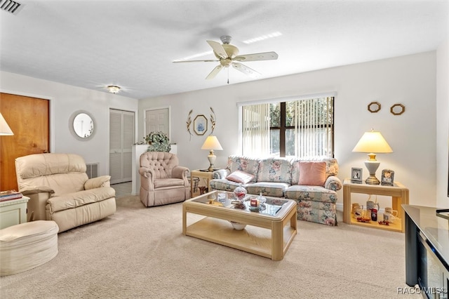 living room with light carpet and ceiling fan