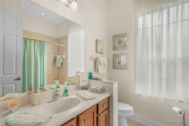 full bathroom featuring shower / bathtub combination with curtain, vanity, and toilet