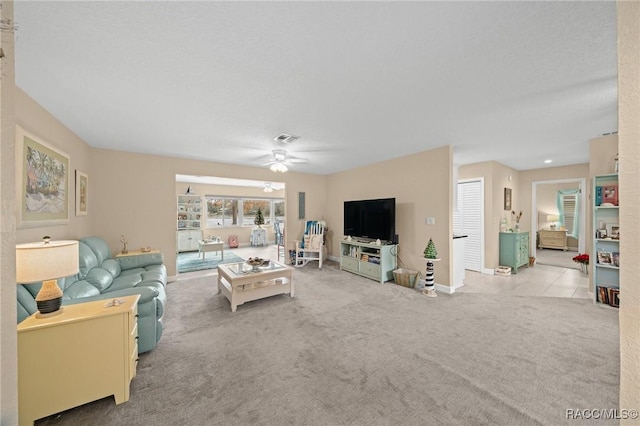 living room with light colored carpet and ceiling fan