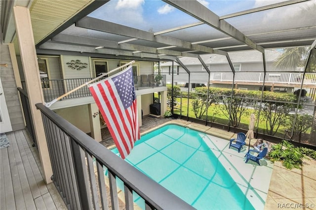 view of pool featuring a lanai