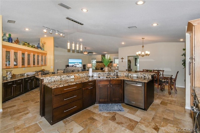 kitchen featuring a large island, decorative light fixtures, lofted ceiling, dishwasher, and sink