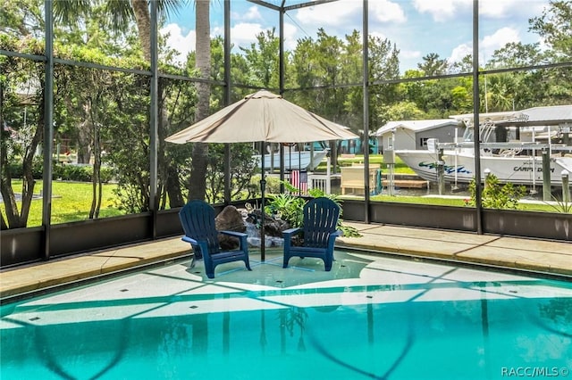 view of pool featuring glass enclosure