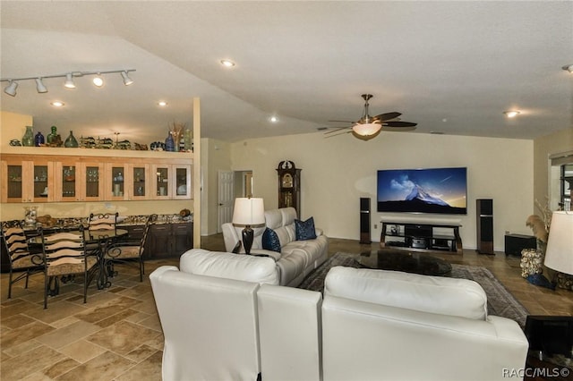 living room with ceiling fan and lofted ceiling