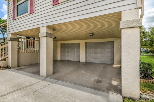 garage featuring a carport