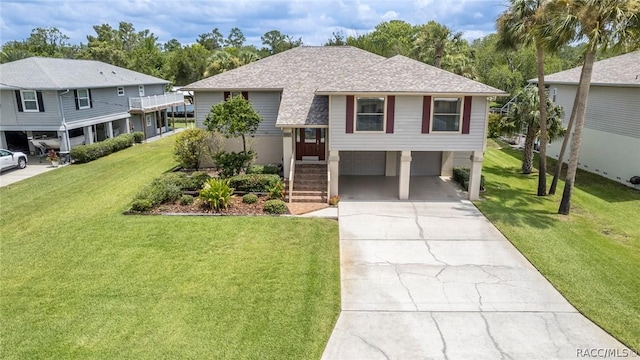 view of front of property featuring a front lawn and a garage