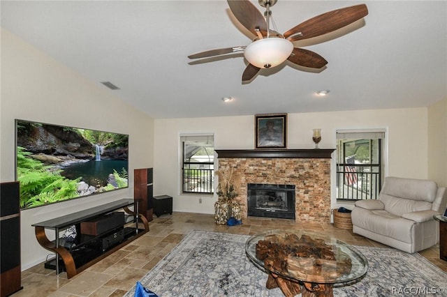 living room featuring ceiling fan and lofted ceiling