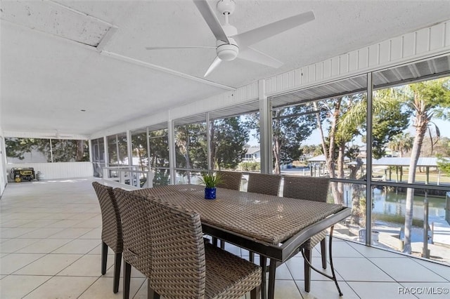 sunroom featuring ceiling fan