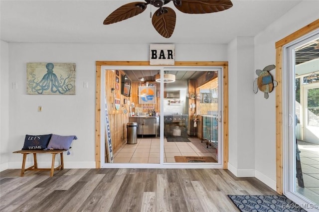 dining area with hardwood / wood-style floors and ceiling fan