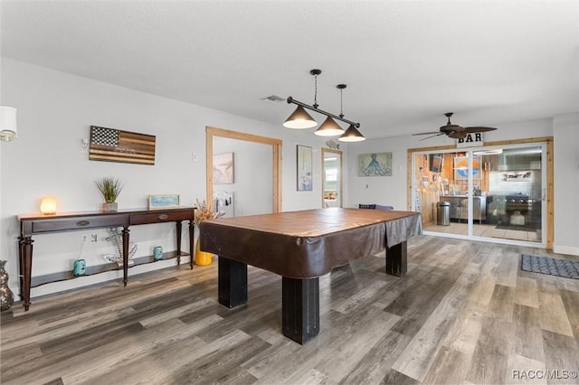 game room featuring ceiling fan, wood-type flooring, a textured ceiling, and pool table