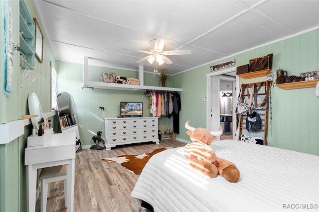 bedroom featuring light wood-type flooring and ceiling fan