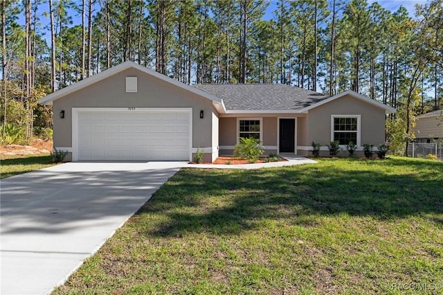 single story home with a garage and a front lawn