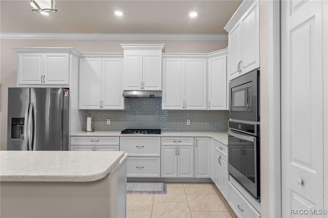 kitchen featuring white cabinetry, ornamental molding, appliances with stainless steel finishes, and tasteful backsplash