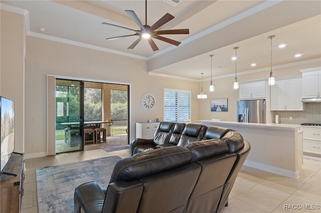 living room featuring light tile patterned floors, crown molding, and ceiling fan