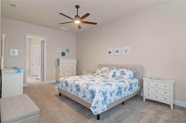 bedroom featuring light carpet and ceiling fan